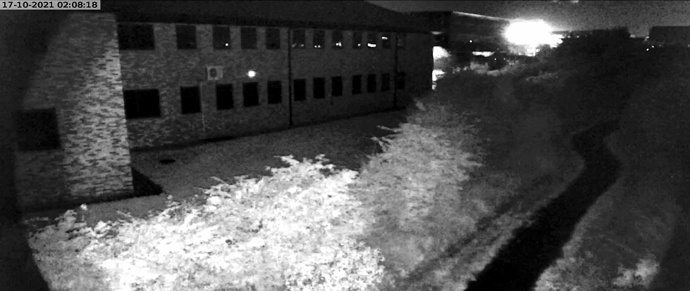 prevention-cure. close up of building at night -camera shot